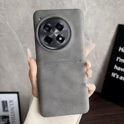 Grey sheepskin card slot phone case with camera cutout and stitched strap detail