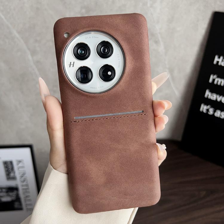 Brown sheepskin card slot phone case with camera cutout and stitched strap detail