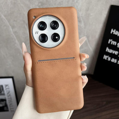 Tan sheepskin card slot phone case with camera cutout and stitched strap detail