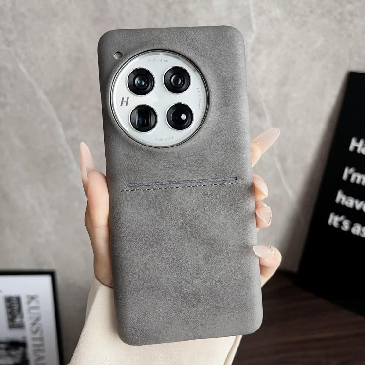 Grey sheepskin card slot phone case with camera cutout and stitched strap detail