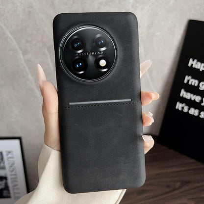 Black leather-style phone case with card slot and camera cutout.