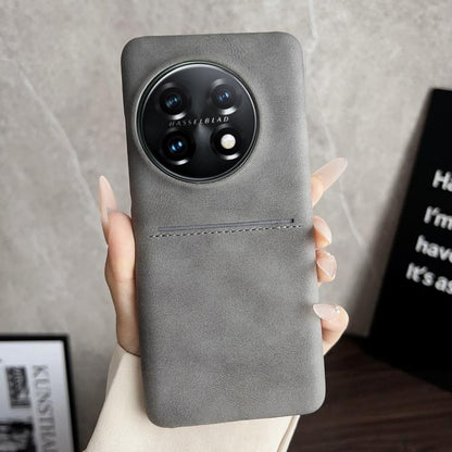 Grey leather-style phone case with card slot and camera cutout.