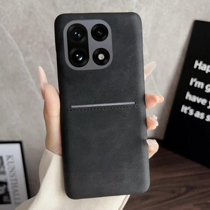 Black sheepskin-feel phone case with card slot and camera cutouts for quad cameras