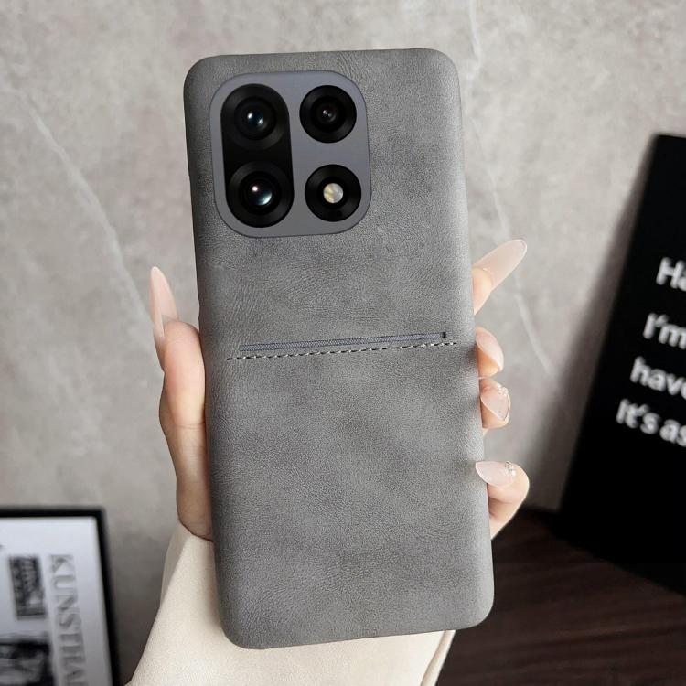 Grey sheepskin-feel phone case with card slot and camera cutouts for quad cameras