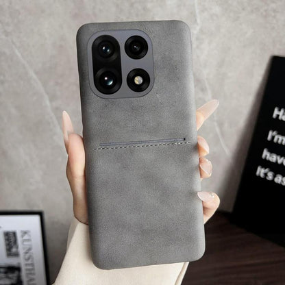 Grey sheepskin-feel phone case with card slot and camera cutouts for quad cameras