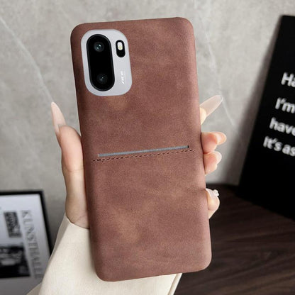 Brown sheepskin-feel phone case with card slot, stitched trim, and camera cutout