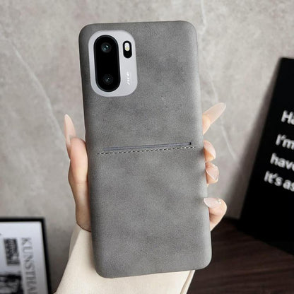 Grey sheepskin-feel phone case with card slot, stitched trim, and camera cutout
