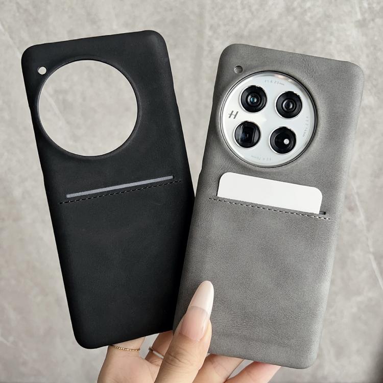 Sheepskin phone case with card slot and camera cutout; black and gray shown