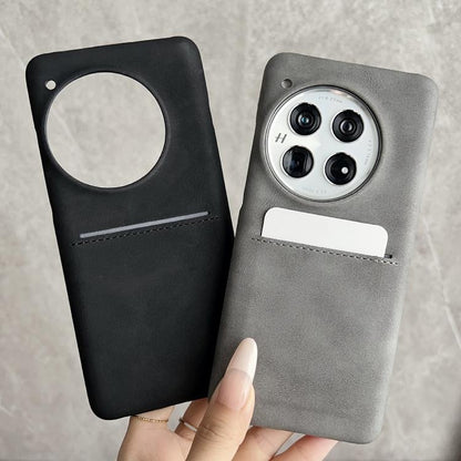 Sheepskin phone case with card slot and camera cutout; black and gray shown