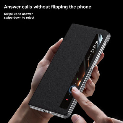 Black leather flip phone case with side buttons and ring holder on the back