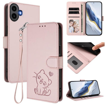 Pink faux leather phone case with embossed cat, hand wrist strap, and card slots