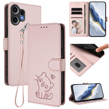 Pink leather phone case with hand strap, embossed cat design and folio cover.