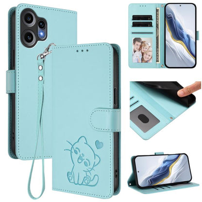 Mint green leather phone case with hand strap, embossed cat design and folio cover.