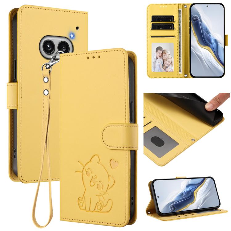 Yellow leather flip phone case with embossed heart cat, wrist strap, card slots.
