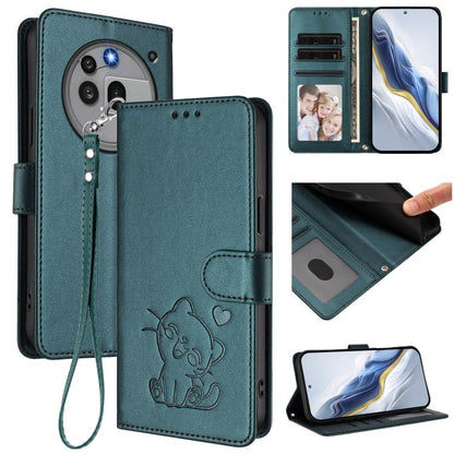 Teal faux leather phone case with embossed cat, hand wrist strap, and card slots