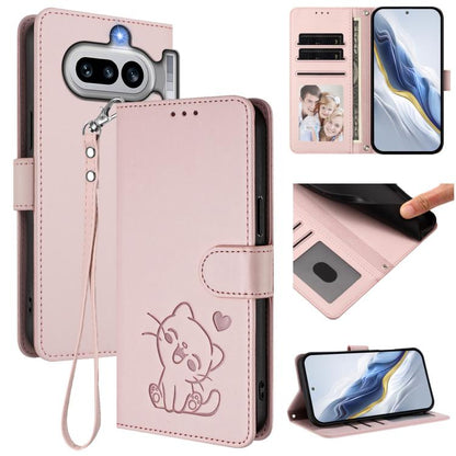Pink leather phone case with embossed heart cat and hand strap, front card holder.