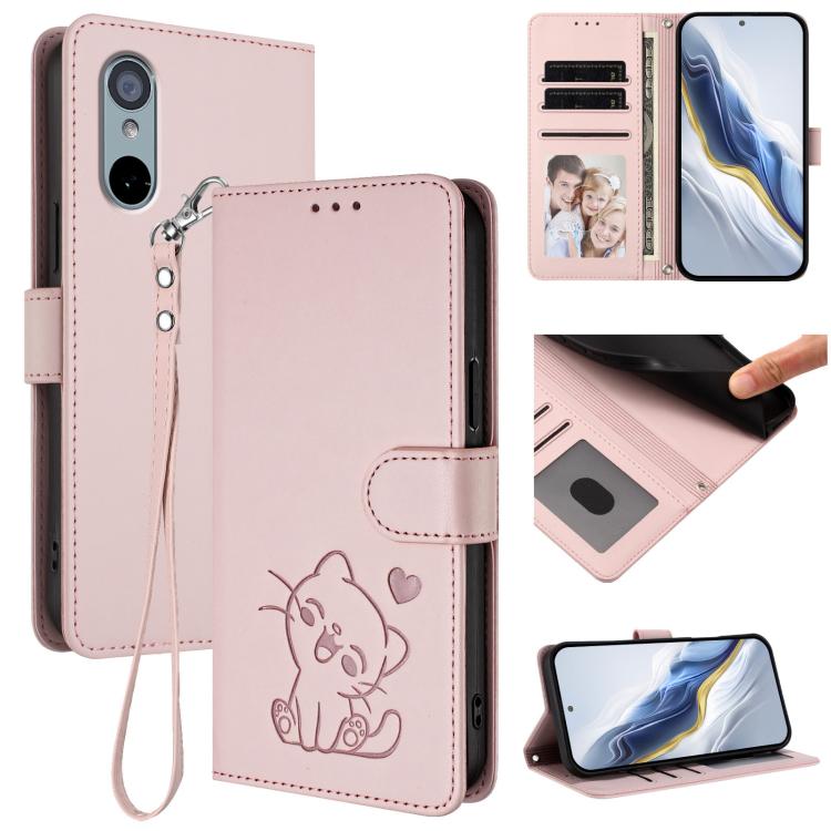 Pink embossed cat-and-heart leather phone case with wrist hand strap and card slots