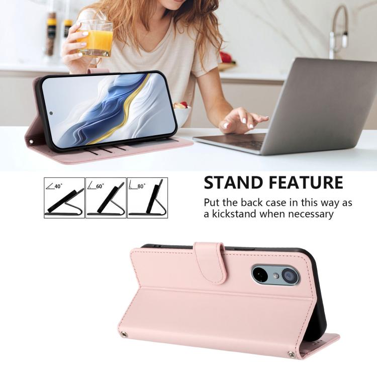 Pink flip phone case with hand strap, standing kickstand, and embossed cat-heart design