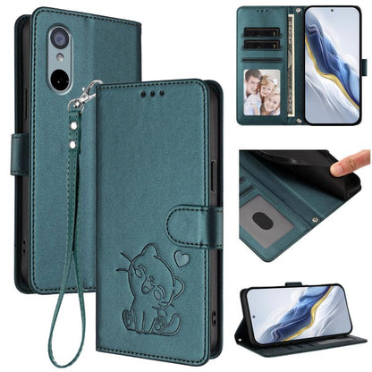 Teal leather phone case with embossed cat and heart, hand strap, folio wallet design.