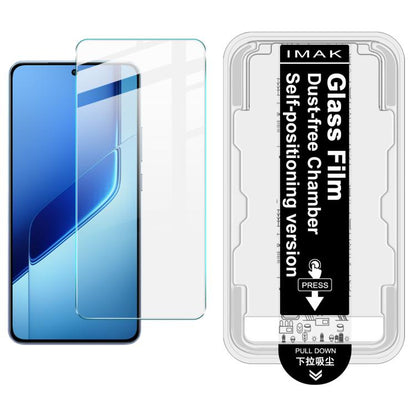 Tempered glass screen protector kit with install frame; clear film on blue phone screen.