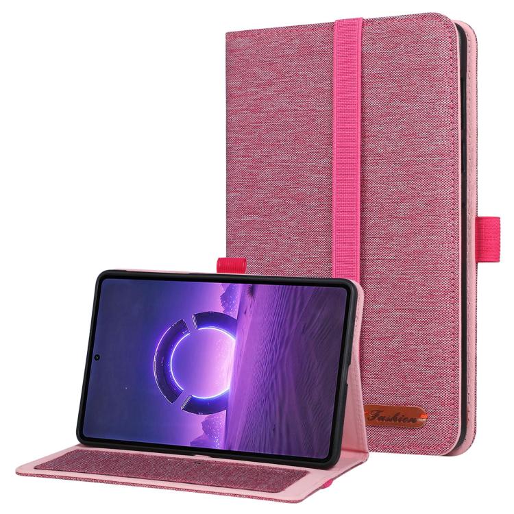 Pink fabric tablet folio case with hand strap, open stand holding a tablet