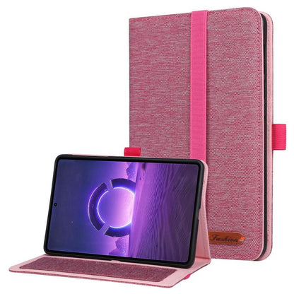 Pink fabric tablet folio case with hand strap, open stand holding a tablet