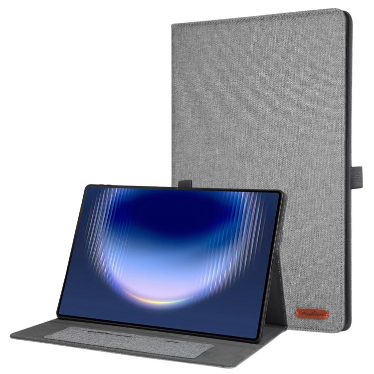 Grey fabric tablet case with flip cover and stand, viewed with tablet device in front