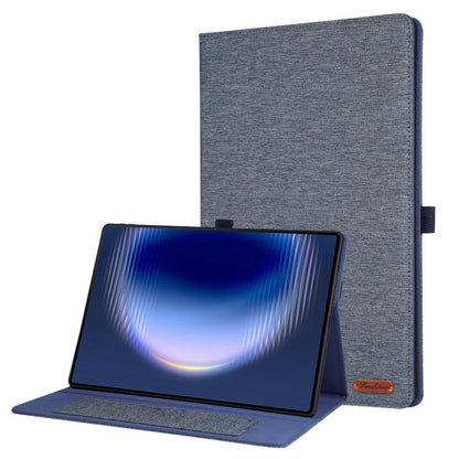 Grey fabric tablet case with flip cover, tablet propped and case upright