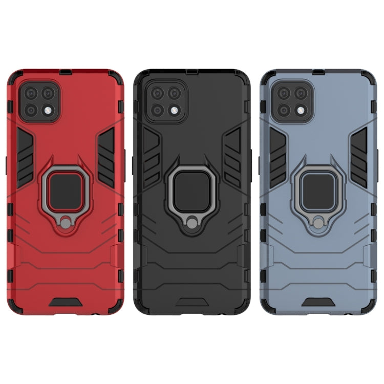 Rugged phone cases in red, black, and navy blue with magnetic ring holder