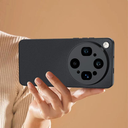 Ultra-thin leather phone case, black, held in hand with camera cutout