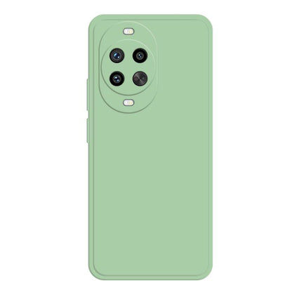 Seafoam green liquid silicone phone case with triple camera cutout and side button cut.