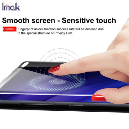 Hands applying privacy hydrogel screen film to smartphone for smooth, touch-ready display