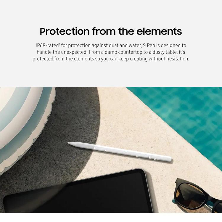 White stylus pen lying on a surface beside a tablet.