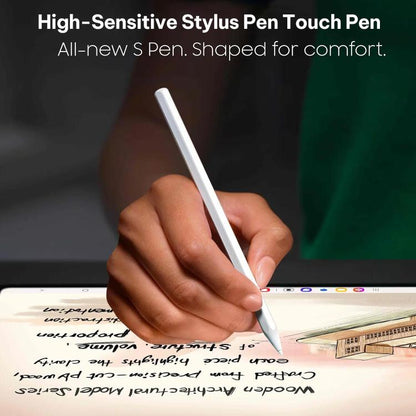Hand holding a white stylus pen writing on a tablet screen.