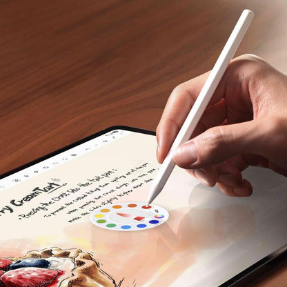Hand using a white stylus pen to write on a tablet screen.