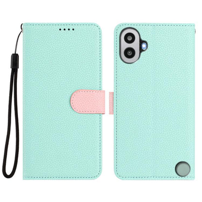 Light mint textured folio phone case with pink snap tab and black wrist strap