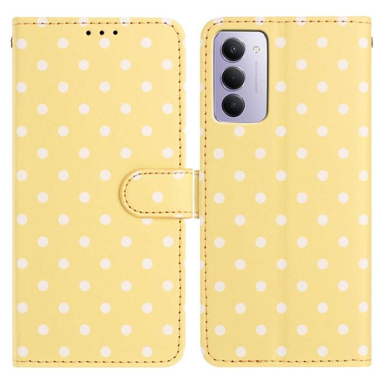 Yellow vegan leather phone case with small white dots and magnetic folio strap