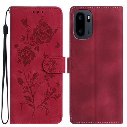 Red faux leather phone wallet case with embossed floral rose pattern and wrist strap.
