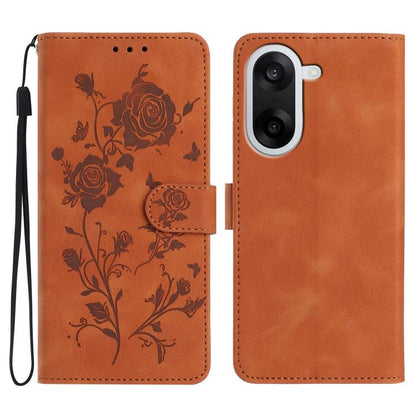 Orange floral leather phone case with rose embossing, magnetic folio and wrist strap