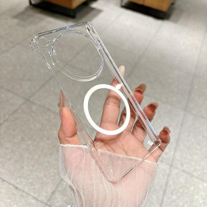 Transparent dual-axis magnetic phone case held in hand, side button and camera cutout visible