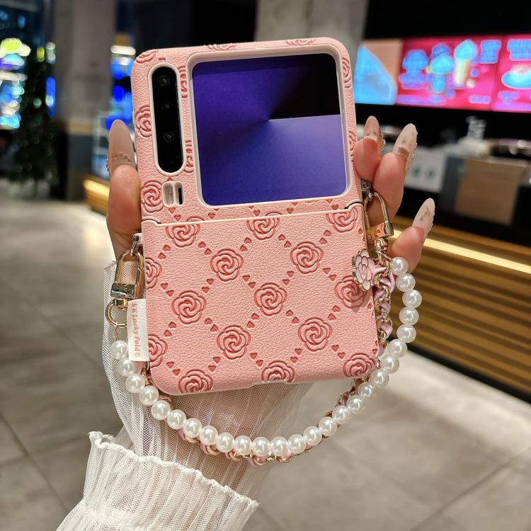 Pink embossed rose phone case with side buckle and pearl beaded bracelet strap