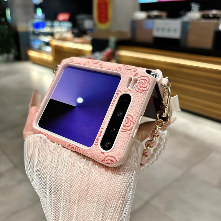 Pink embossed rose phone case with side buckle and pearl beaded bracelet strap