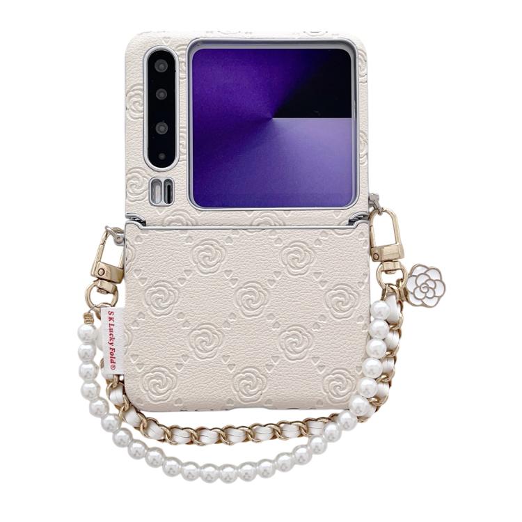 Light beige embossed phone case with rose pattern, side buckle, and pearl bead wrist strap