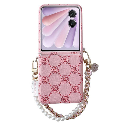 Pink embossed rose phone case with wristlet chain and card-sized flip cover