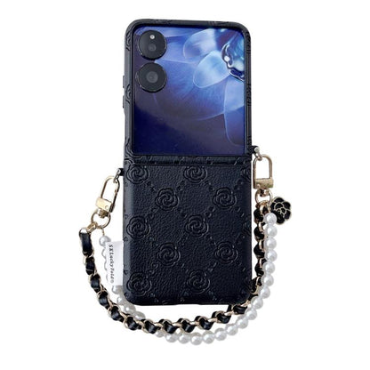 Black embossed rose phone case with side buckle and pearl beaded bracelet strap