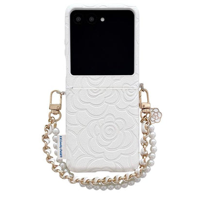 White embossed camellia phone case with side buckle and pearl bracelet strap.
