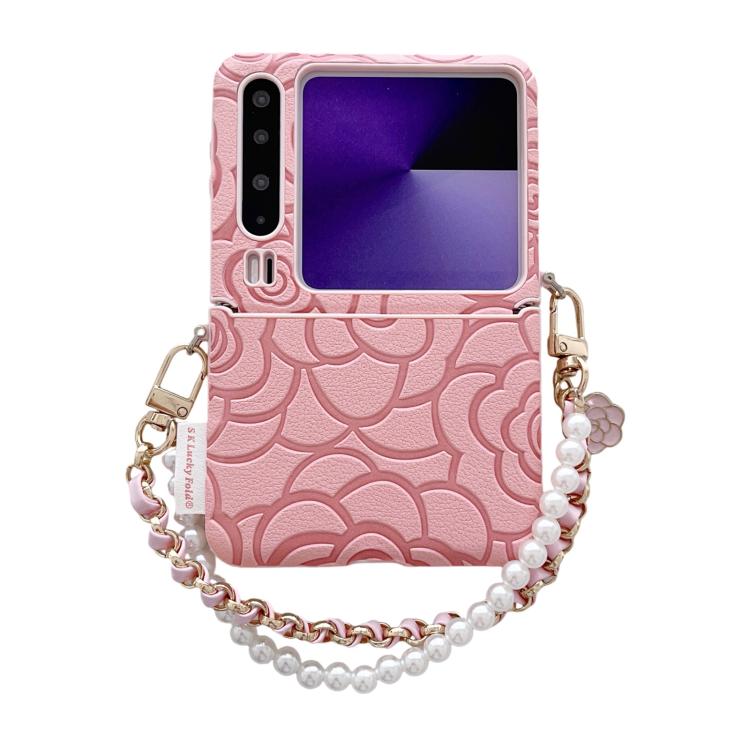 Pink embossed camellia phone case with side buckle and pearl chain wrist strap