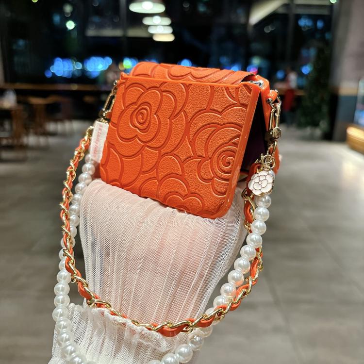 Orange embossed camellia phone case with side buckle and pearl chain shoulder strap