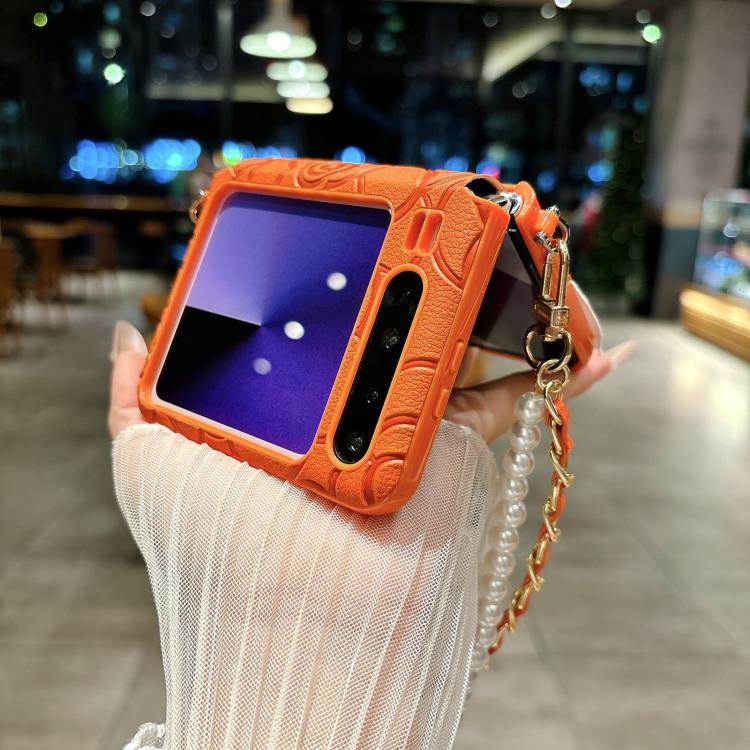 Orange embossed camellia phone case with side buckle and pearl chain wrist strap