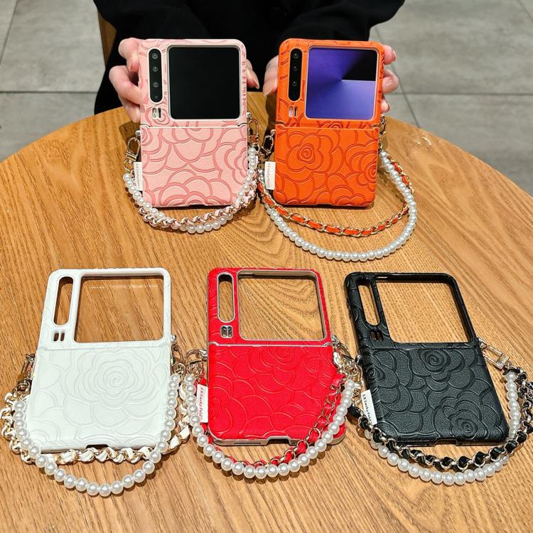 Embroidered phone cases with pearl chain straps in white, red, and black color options